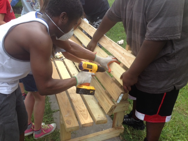 People constructing benches.